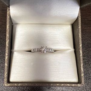 SOLD!!! Solitaire Diamond engagement ring with side accent diamonds.